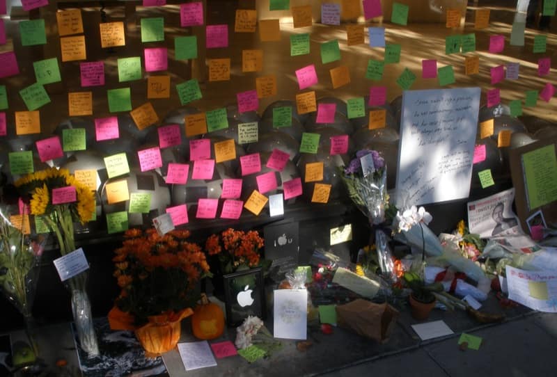 Post-It notes and flowers left as a tribute outside the Apple Store in Palo Alto two days after Steve Jobs's death